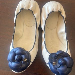 Chanel White leather with navy trim and flower